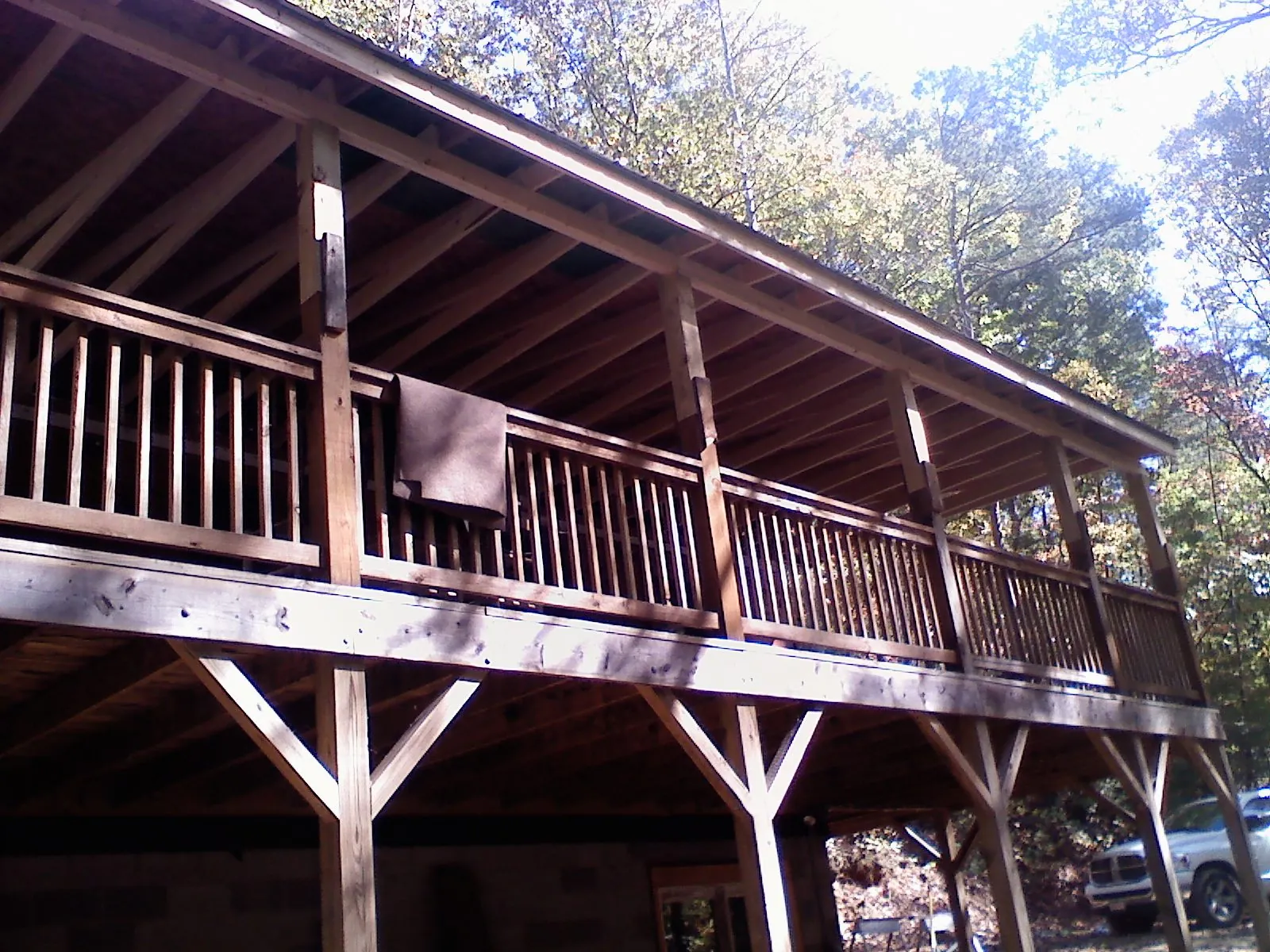 Timber framing under a new elevated porch and deck — Roof Leak Repair in Waynesville by Roofing Brothers